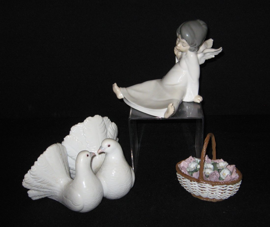 3 Lladro porcelain figurines,: Including a seating angel number 4962, seated doves number 1169, and a flower basket, largest 7".