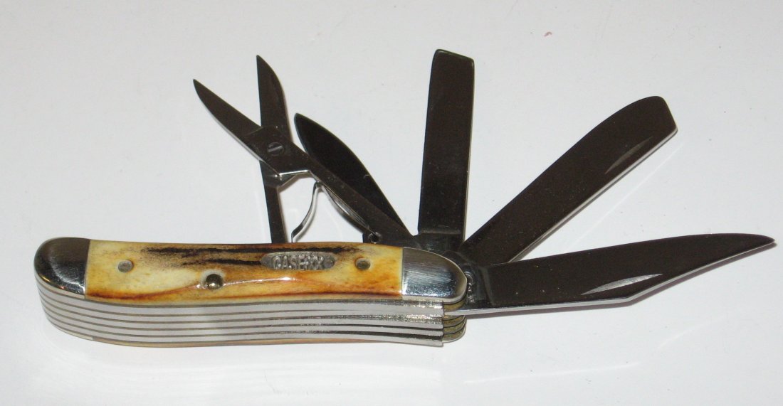 Case XXX pen knife,: Five blade knife in amber bone, 2 3/4" long.