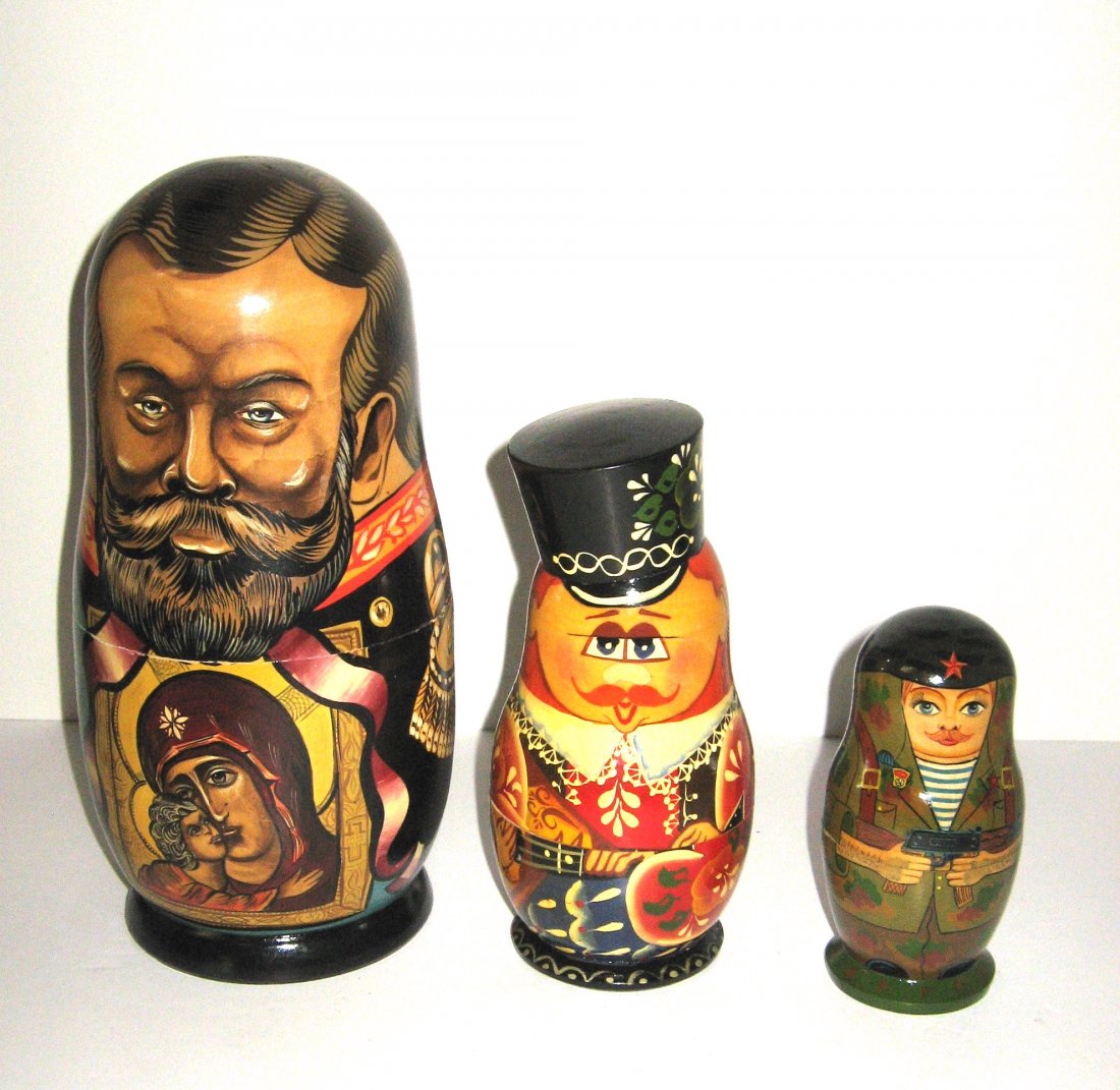 Three Russian lacquer doll sets,: Including large 10 piece set of historical figures, a fanciful nut cracker, and a Soviet soldier set, tallest 10 1/2' ht.