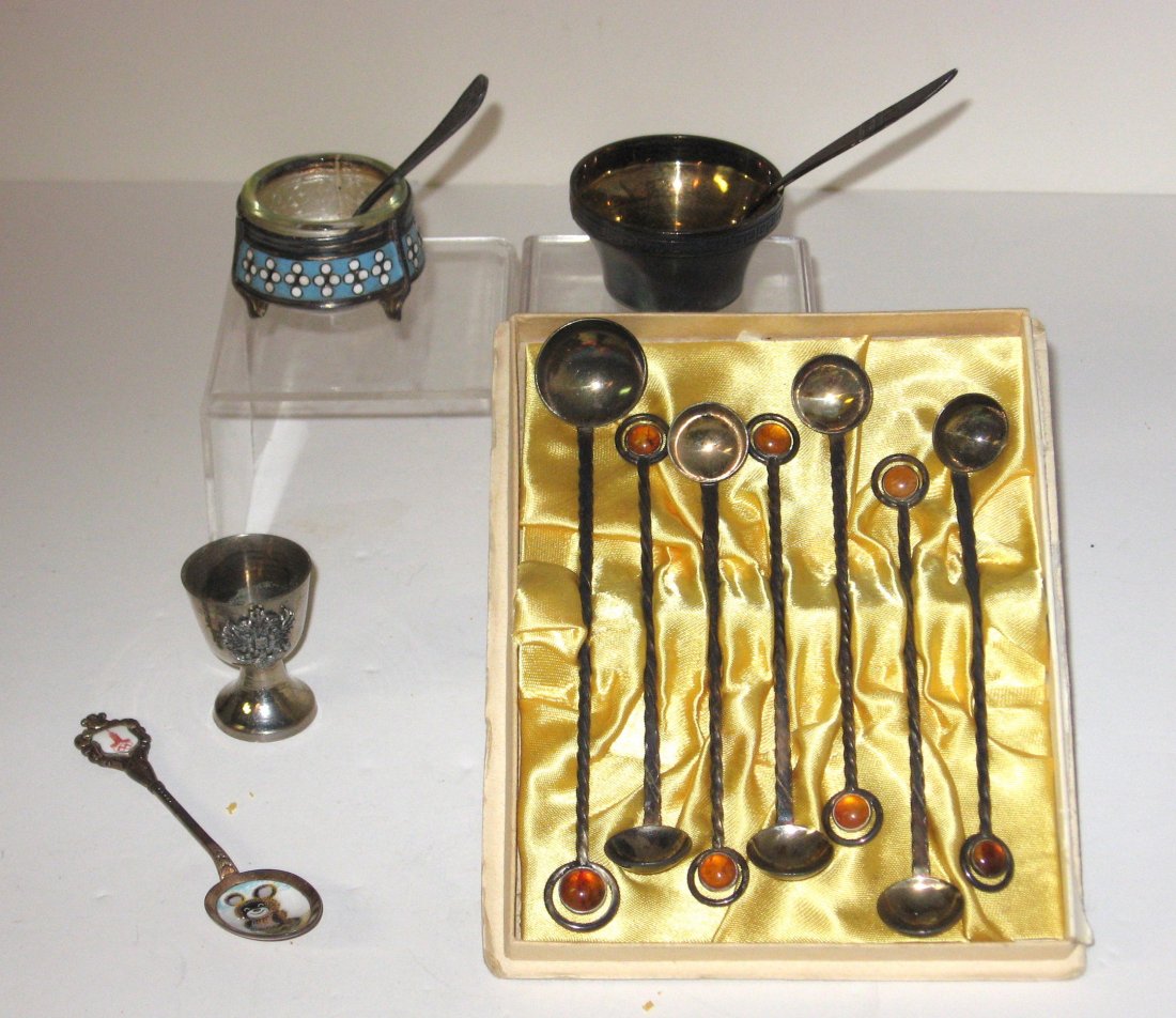 Group of 20th century Russian metal items,: Including an enameled Misha Mascot Olympic spoon marked Versilbert, a diminutive chalice with double headed eagle, a set of jeweled spoons marked MET, Silver salt and spoon both marked 916 and an enam