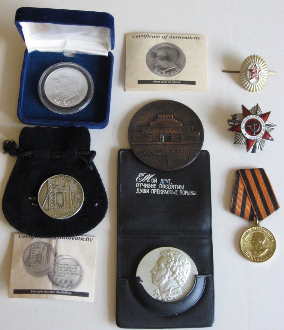 Group of Russian medal and medallions.: Including the First man in space, Energia Rocket Medallion, a Soviet Order of the Patriotic war, and more.