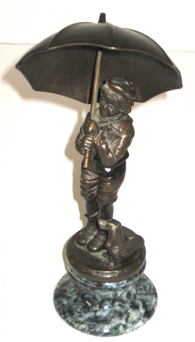 Bronze figurine of a boy and dog,: Standing boy holding an umbrella with faithful dachshund at his feet, set on a marble base, 10" ht.