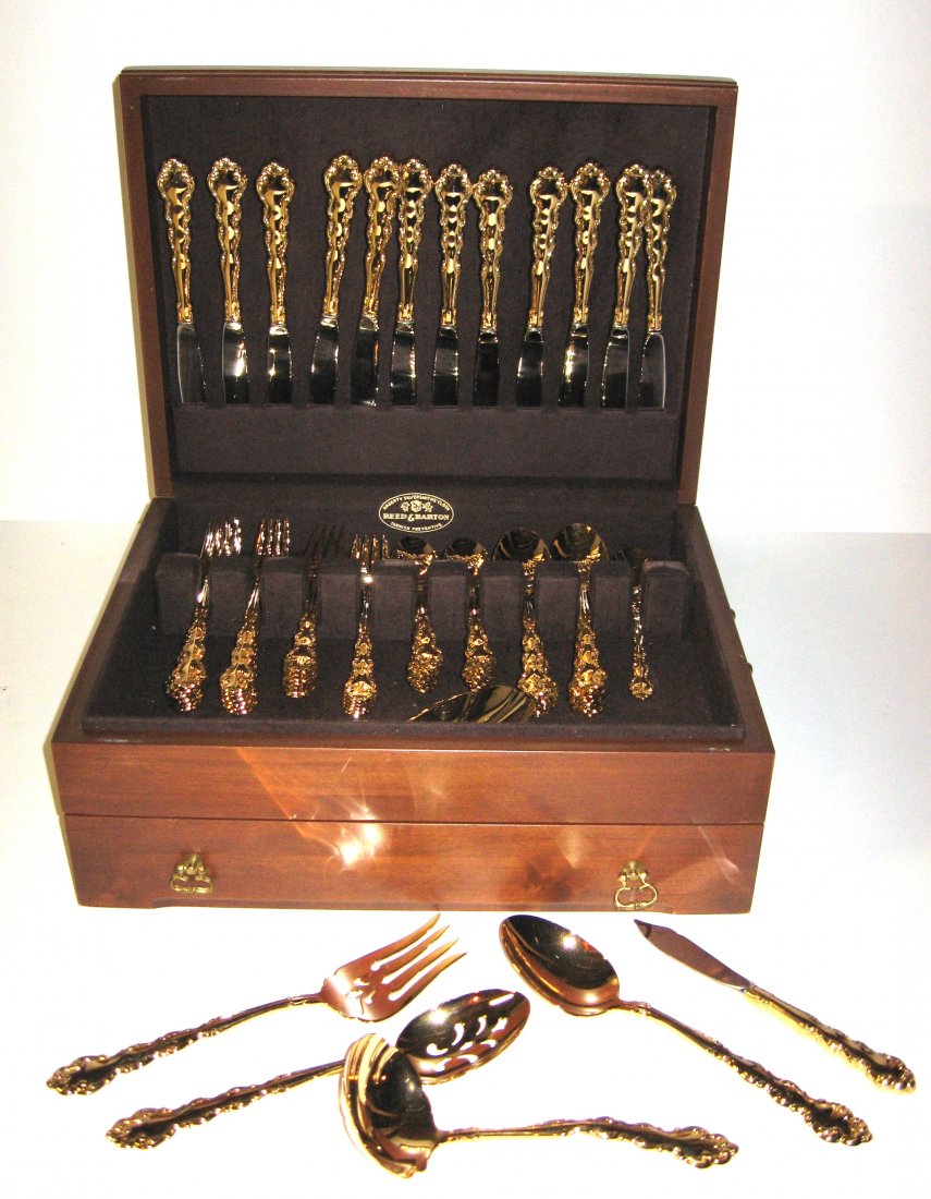 Set of Oneida gold washed Community Flatware,: Oneida flatware service for 12 including 12 knives, 12 dinner forks, 12 luncheon forks, 12 spoons, 12 soup spoons, and 7 serving pieces, set in a wood box.