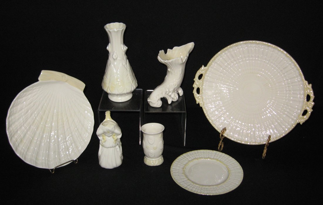 Group of Vintage Belleek porcelain,: Including a black mark Belleek shell form plate, a first green mark Limpet two handle tray, a Limpet bread, and four 6th mark vases, tray 11' wide.