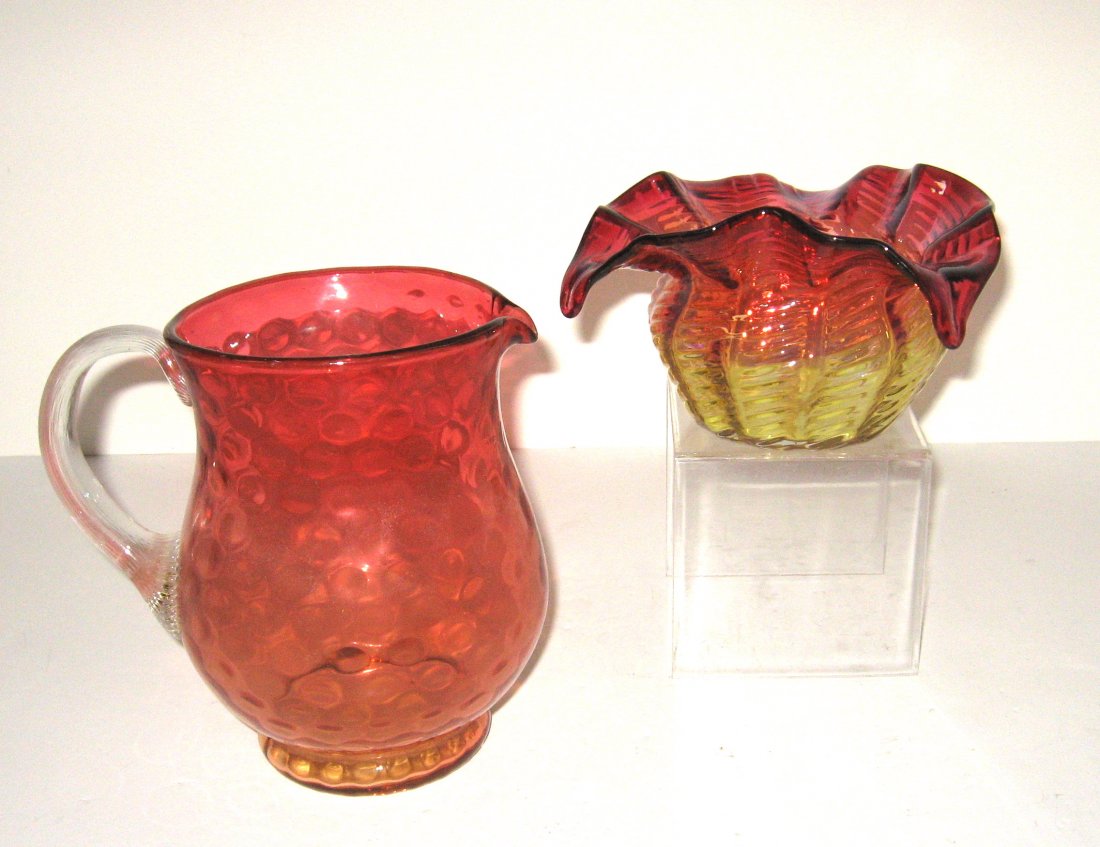 Two Amberina glass items,: Including a water pitcher with reeded handle together with a Rubina Verde bowl with an exaggerated tri-fold rim, tallest 7" ht.