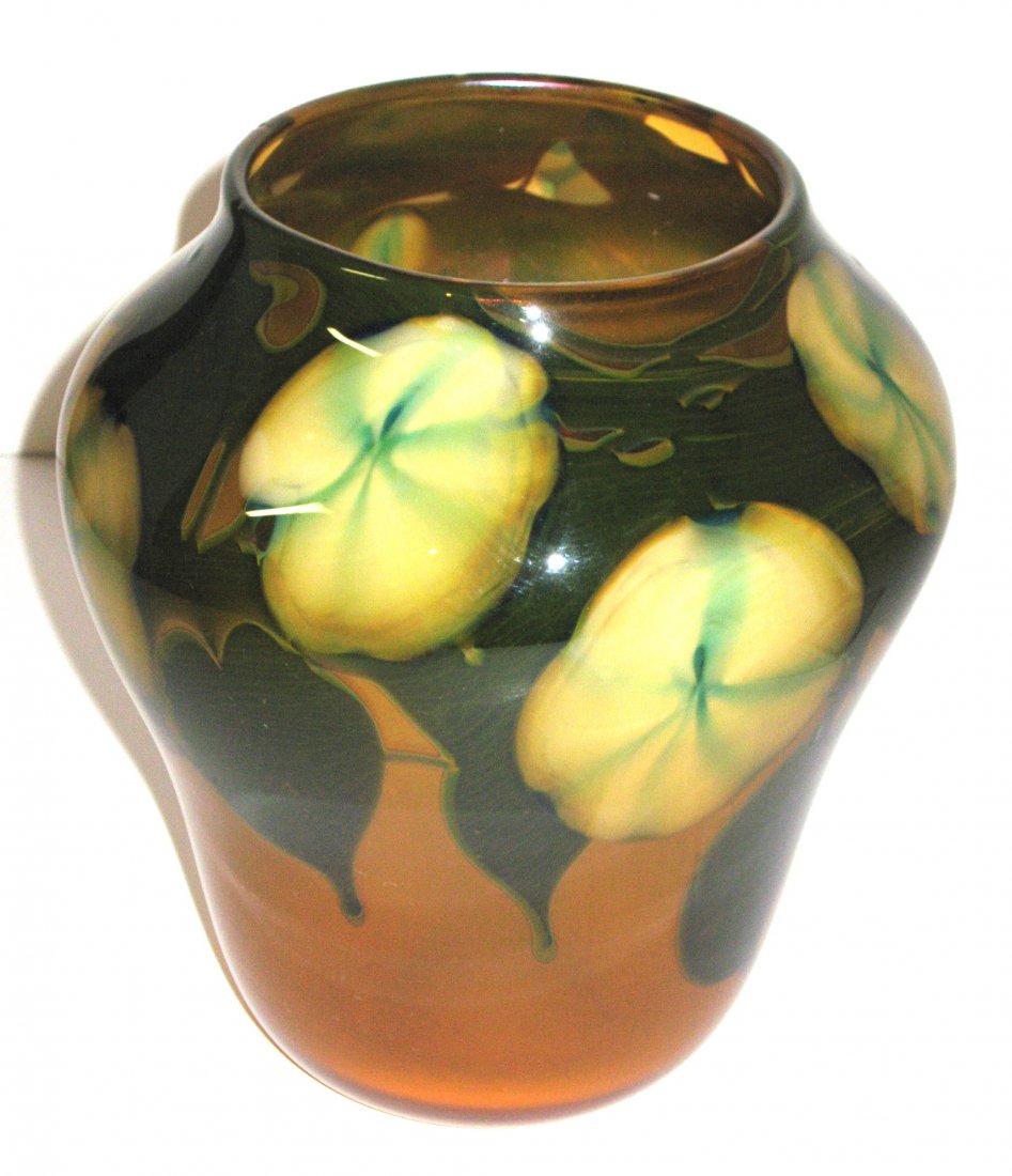 Early Charles Lotton Multi Flora vase,: Ovoid coupe in amber sunset glass decorated with large white blossoms on green leaves, signed Lotton 1974, 8' ht.