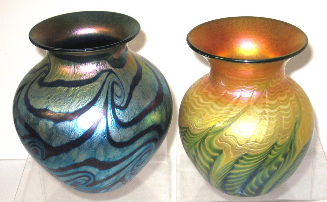 Two Lundberg art glass vases,: Including a Moire Fern gold vase with green fern, signed 1997 Lundberg Studios, together with a blue "Van Gogh Sunset" vase shading from blue to gold with a dark swirl pattern, signed Lundberg Studios