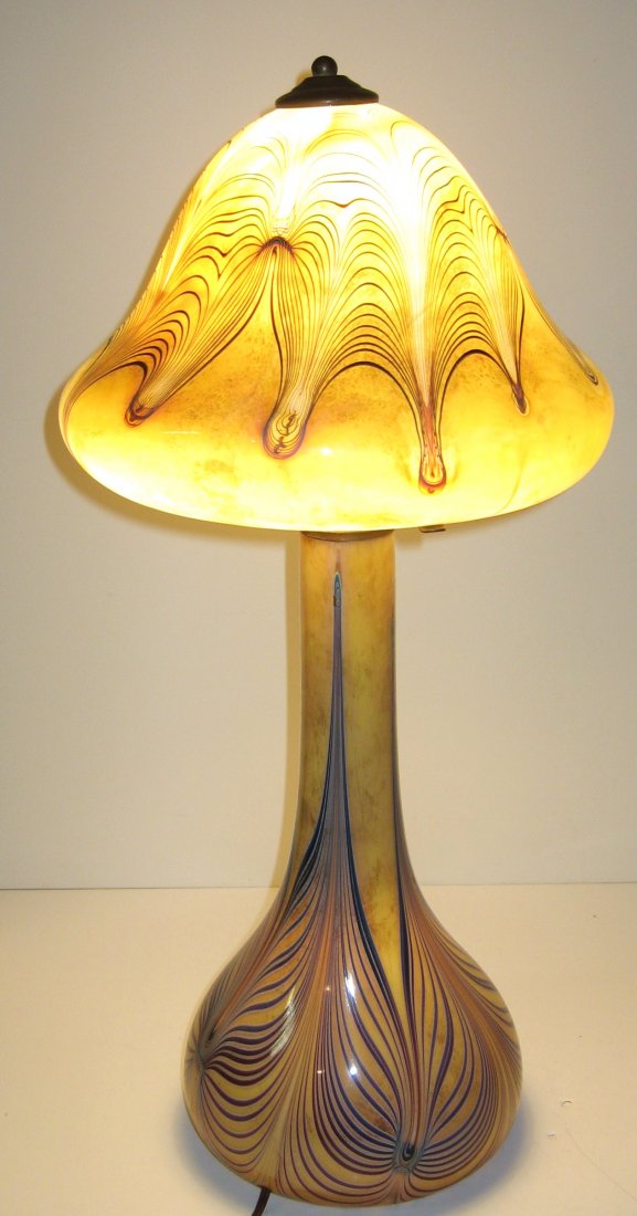 Joe Clearman art glass lamp,: Mushroom form in mottled yellow glass decorated with a blue pulled feather design, signed J Clearman 1976, 23" ht.