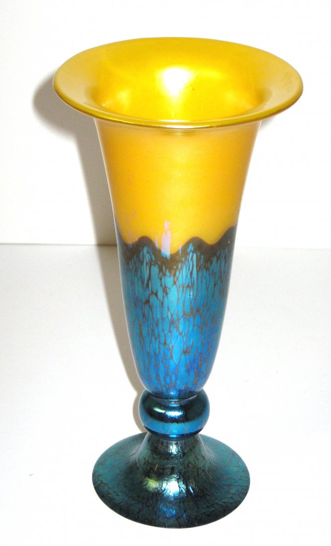 Loetz Tango and iridescent glass vase,: Blue iridescent Papillion foot extend up a trumpet form Tango vase in bright yellow, signed Czecho Slovakia, 9" ht. LITERATURE: see Loetz Bohemian Glass 1880-1940 page 263.