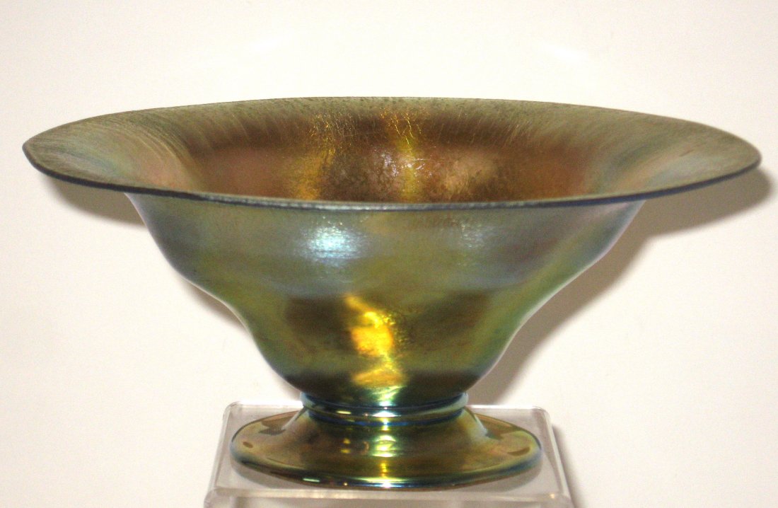 Tiffany Gold Favrile glass compote,: Footed gold compote with an undulating and pinched sided form, signed 1848 L. C. Tiffany -Favrile, 8" wide.