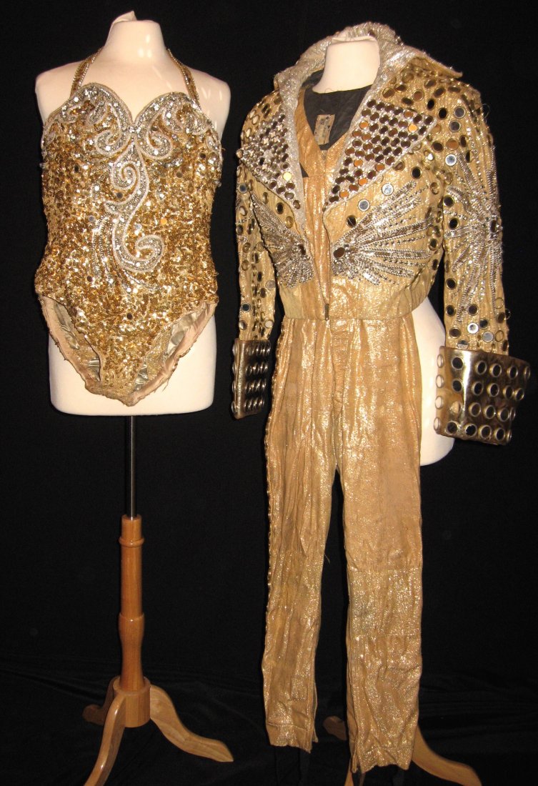 Two gold Urias circus costumes,: Including a mans and a women's in gold with overall sequins, mans made by Brooks and Van Horn. PROVENANCE: Victor and Kathia Urias to current owner.