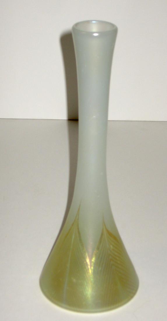 Tiffany Favrile glass vase,: Reverse trumpet form in opal glass decorated with gold pulled feathers, signed 5656 L. L. C. Tiffany Favrile, 10" ht. Condition: good, with no chips, cracks, or repairs.