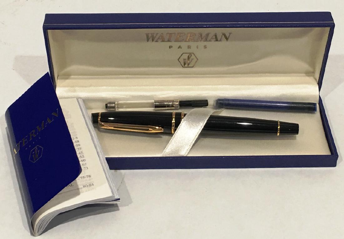 WATERMAN FOUNTAIN PEN: BLACK AND GOLD, IN ORIGINAL BOX WITH PAPERWORK, 2 INK REFILLS