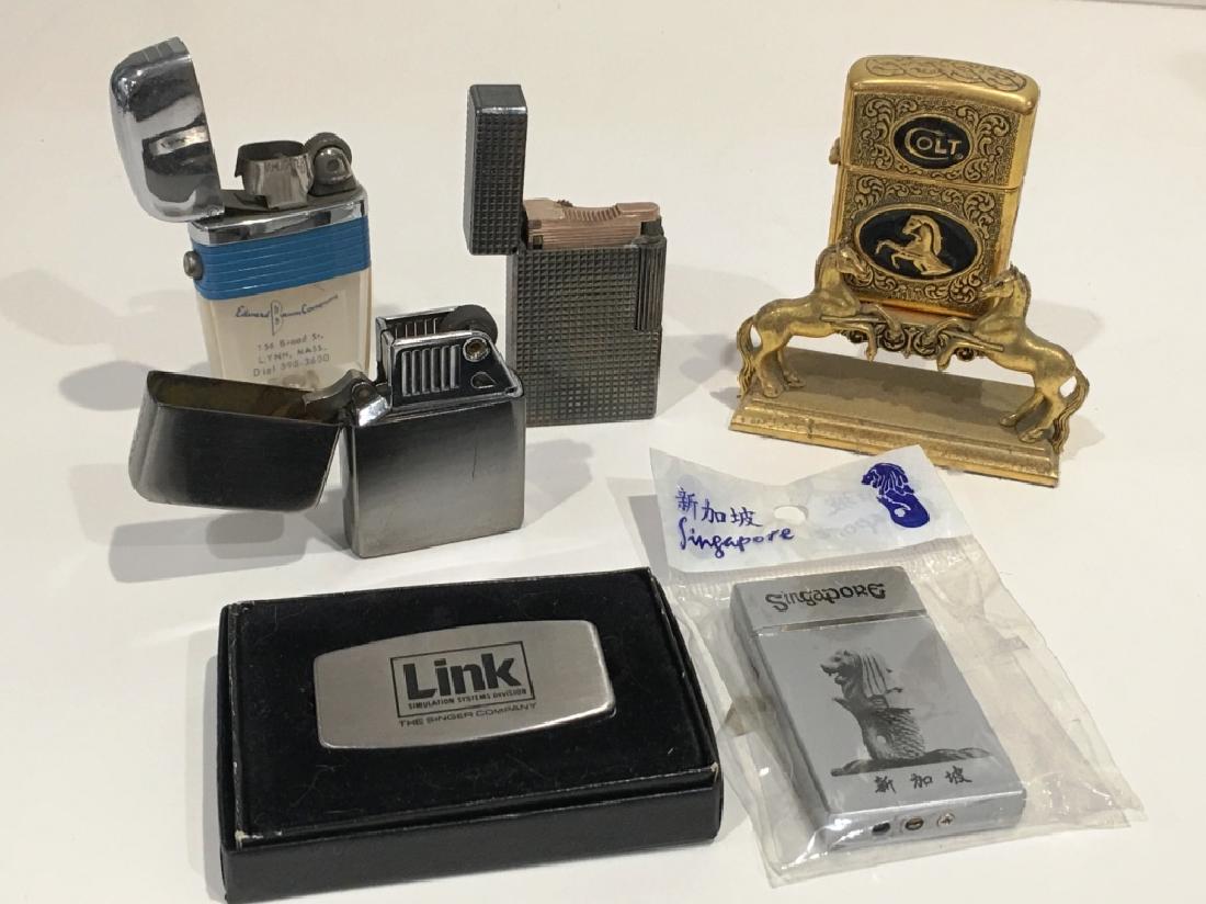5 LIGHTERS & 1 MONEY CLIP: 1 COLT LIGHTER WITH STAND, 1 DUPONT, 1 RONSON, 2 OTHERS