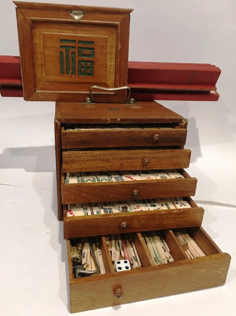 VINTAGE MAH JONG SET: IN SELF CONTAINED WOODEN BOX, WITH CARRY BOX, 4 WOODEN TRAYS, RULE BOOKS, AND MANY ACCESSORIES (SEE PHOTO)