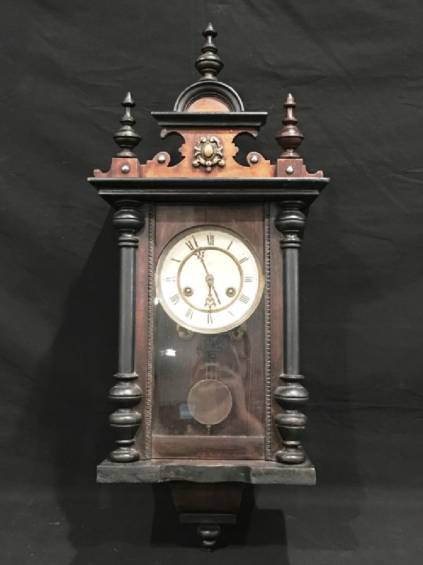 VICTORIAN STYLE WALL CLOCK WITH ORNATE FINIALS: JUNGHANS MOVEMENT, HAS PENDULLM AND KEY, 27" X 11.75"