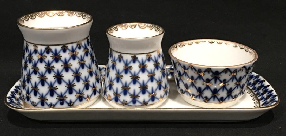4 PC SPICE SET LOMONOSOV COBALT NET: ST. PETERSBURG, CIRCA 1744, TRAY- 7 1/4" x 3", SALT CELLAR- 2 1/4" x 2 1/4", PEPPER BOX- 2" x 1 7/8", AND SAUCE BOAT- 1 1/4" x 2 3/8", MARKED ON BOTTOM, EXCELLENT CONDITION