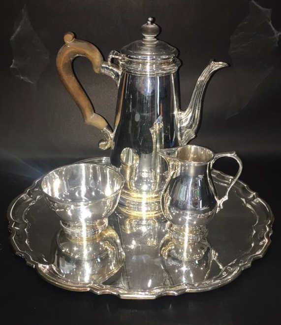 Tiffany and Company sterling silver coffee/tea set: Circa 1947-1956, Pattering 22938-21742, Tray: pattern 21742 and 12 inches in diameter, Coffee/tea pot: pattern 22938 and 8 1/4 inches tall, creamer: pattern 22938 and 3 5/8 inches tall,Sugar bowl: pat