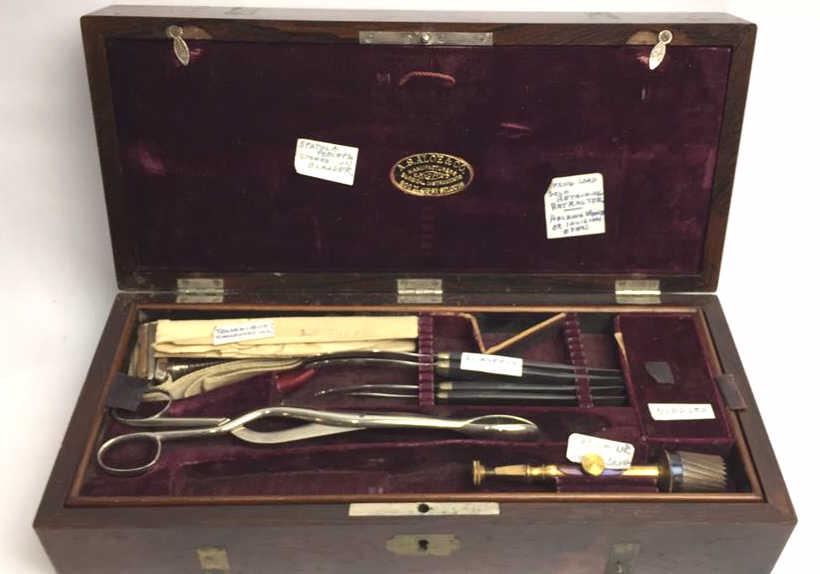 A.S. Aloe and Co. Mfg. Surgical Instruments: Civil War era, with box and leather case, contains: spatula forceps, spring load self retaining retractor, tourniquet, scalpels, needles, trephine, amputation knives, hand saw, amputation saw, handles