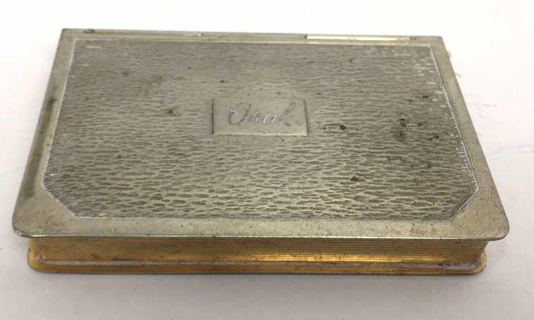 Beauty Compact marked DFB Co.: Engraved, 3 inches by 2 inches by .5 inches