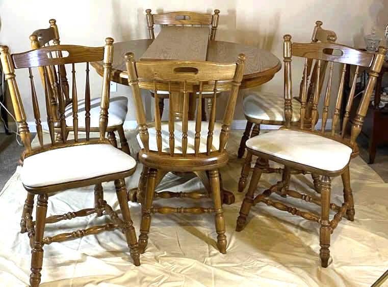 Oak Kitchenette Dining Table and Chairs: 6 chairs, with one extra leaf, 30 inches tall by 42 inches in diameter, see photo