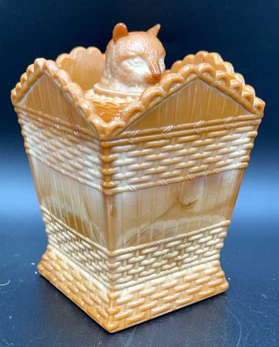 Greentown Chocolate Glass Cat in Hamper: Covered Dish with cat head on lid, Indiana Tumbler & Goblet Co. Early 20th century. 5 inches by 3.5 inches, see photo