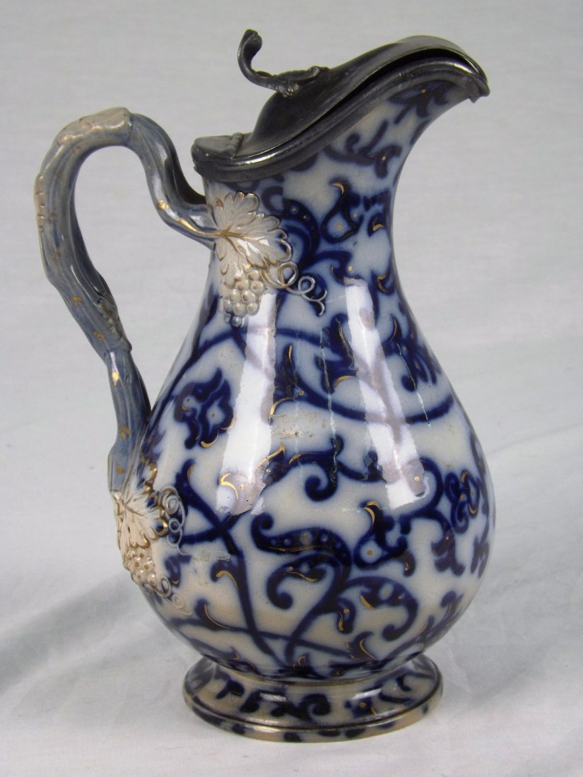 Flow Blue, pitcher: Flow blue pitcher, with metal lid attached, measuring 9" tall