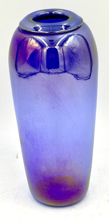 Iridescent Art Glass Vase Blue Purple Signed: A tall, hand-blown art glass vase displays shifting iridescent colors of blue, purple, and magenta, featuring an etched and partially legible signature inscription on the base rim, it is 9 inches tall