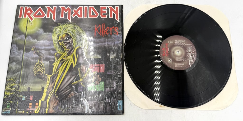 Iron Maiden Killers Black Vinyl LP Album ST-12141: A black vinyl LP and sleeve for the Iron Maiden album Killers, featuring catalog number ST-12141, produced by Martin Birch, with the runout groove stamped MASTERED BY CAPITOL.