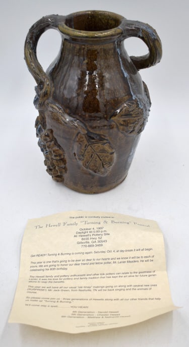 Grace Nell Hewell Folk Art Pottery Storage Jug: Grapevine motif, 10 inches by 6.75 inches, signed on bottom, with information paper from original purchase, no damage, see photos