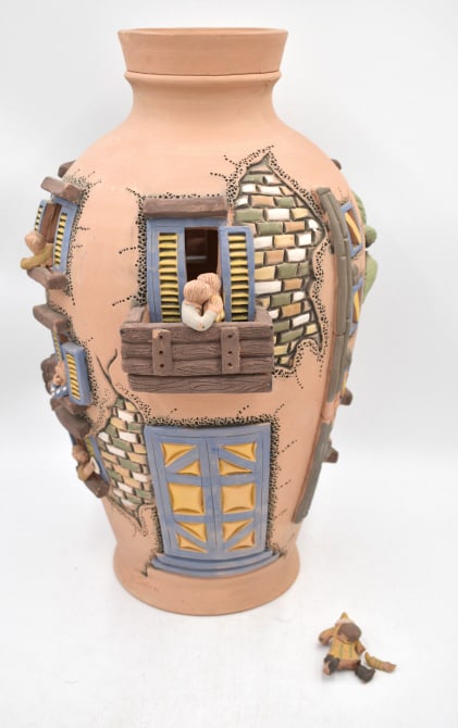Sculpture Pottery Folk Art Building Scene Vase: Depicts scene of windows and balconies with people in them, palm trees, with damage to some people, 19.75 inches by 13.25 inches, signed on side, see photos