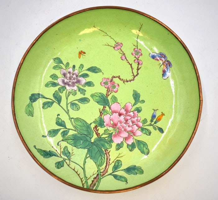 Chinese Canton Enamel on Copper Dish: 8 inches by .5 inch, lime-green background decorated with pink peonies and butterflies, circa 1891- 1921, stamped CHINA on the bottom,