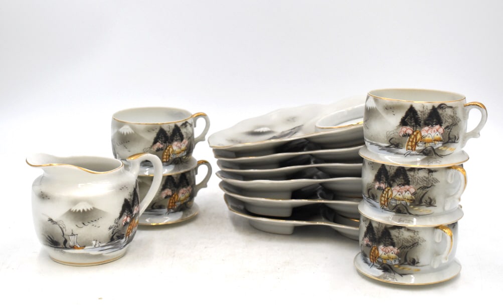 12 PC. Kutani China Tea Set: Plate are 8.5 inches long by 5 inches wide, tea cups are 2 inches tall by 3.75 inches wide, and cream glass is 3.25 inches tall by 4.75 inches wide, marked on bottom, please see photos.