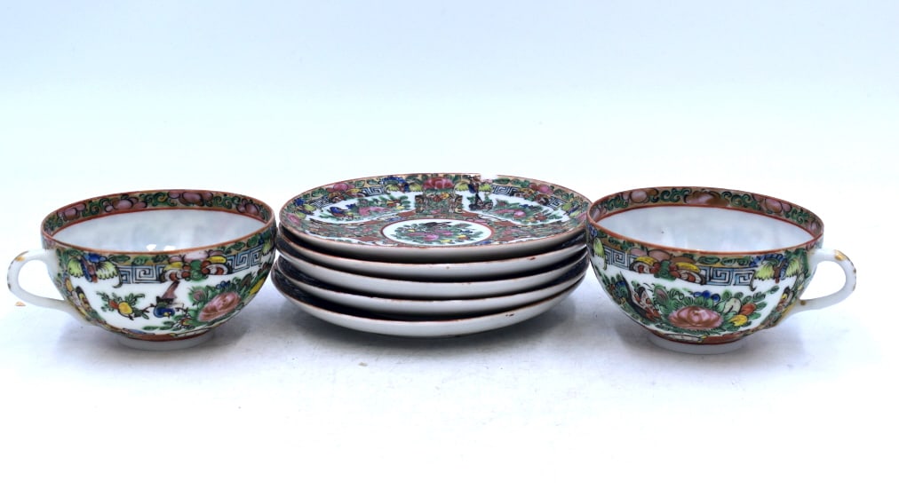 7 PC. Imari Tea and Plate Set: 5 plates that are 5.5 inches wide by .5 inches tall, and 2 cups that are 4.5 inches wide by 2 inches tall, stamped on bottoms, small chipping on plates.