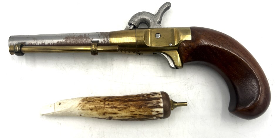 CMC Black Powder Boot Pistol: Single shot, black powder percussion pistol. Cast brass receiver, spur trigger, and smooth wooden grip. Comes with small handle tool carved in the shape of an eagle. See photos
