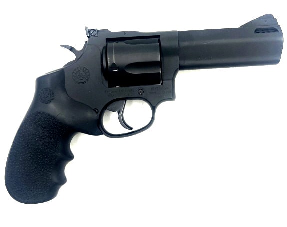 Tracker 44 Magnum Revolver: 4 inch barrel length, 5 rounds, fixed front sight, slight wear and scuff marks. See photos