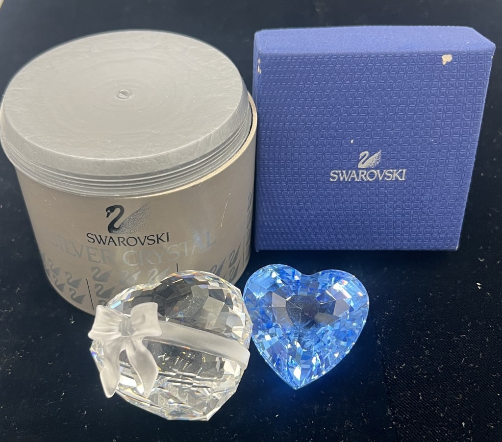 2- Swarovski Heart Paperweights: Blue heart and Clear heart with frosted bow. Comes with boxes. See photos