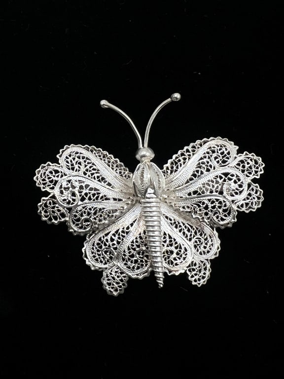 Silver-Toned Butterfly Broach: 2x1.5 inches.Unmarked. Non-Magnetic. See photos