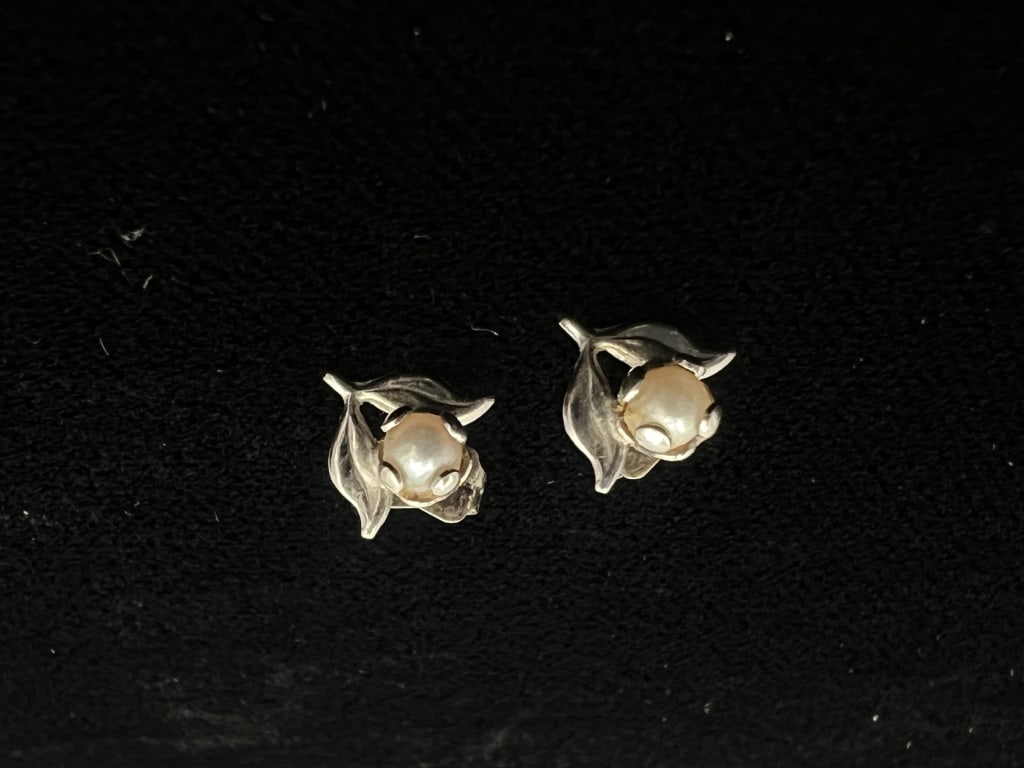 Floral Pearl Earrings: Pearl set in floral design with leaves on the side. See photos
