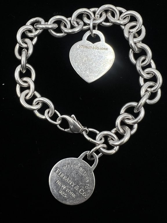 SS Tiffany Engraved Charm Bracelet: 7 inches, features two charms (one engraved with "Mom"), clasp works. Sterling silver, total weight 43.3 grams, See photos