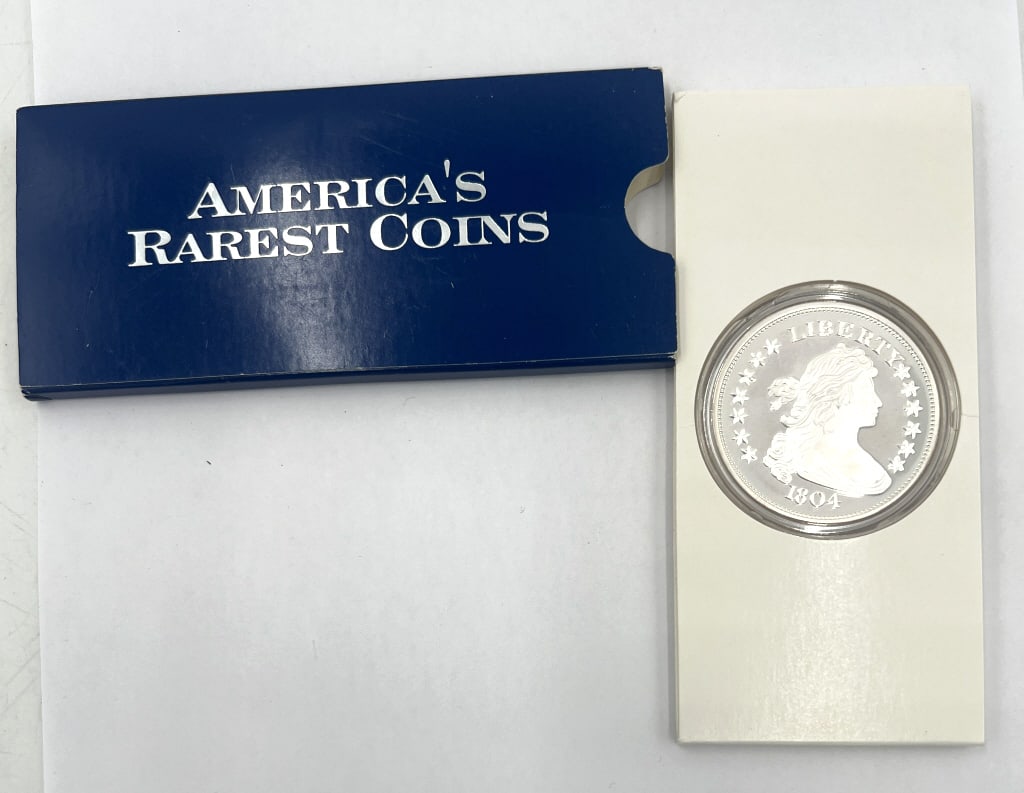 1804 Silver Draped Bust COPY Commemorative Coin: Contains 2ozs. Of .999 pure silver. Distributed by America?s Rarest Coins. Comes in original sleeve. See photos.
