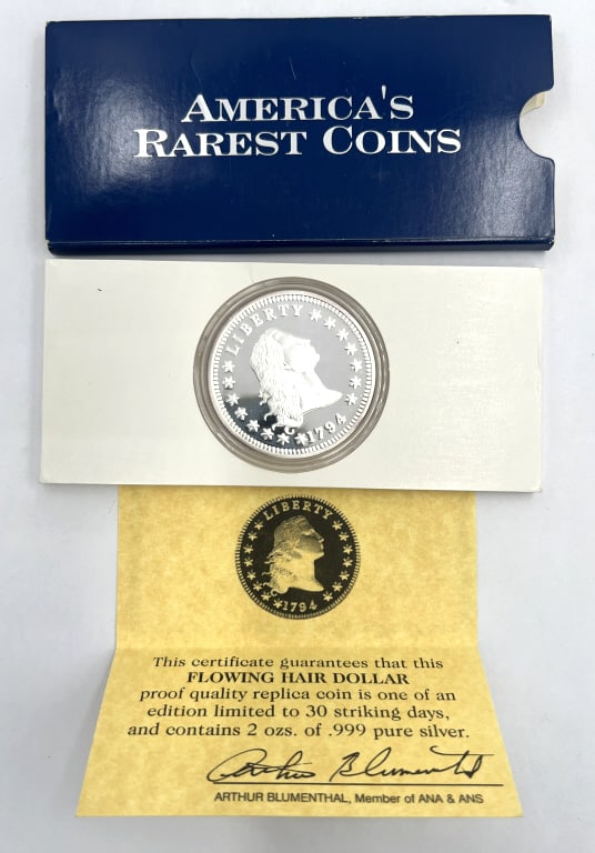 1794 Flowing Hair Dollar COPY Commemorative Coin: Contains 2ozs. Of .999 pure silver. Distributed by America?s Rarest Coins. Comes in original sleeve. See photos.