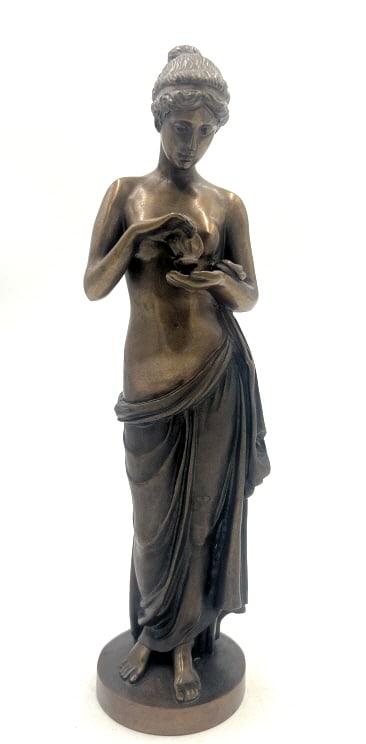Russian Bronze Sculpture: 3x2.75x10.62 inches. Solid bronze sculpture showing woman holding a small item. Has stamp on bottom rim. See photos.