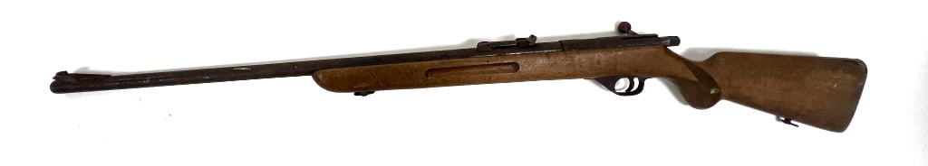 Pre-WWII ERMA German Rifle: 25.25 inch barrel length, 43.5 inches overall length, .22 LR, single shot, bolt action. Can be cocked and trigger works. Very visible rust and aged wear. See photos