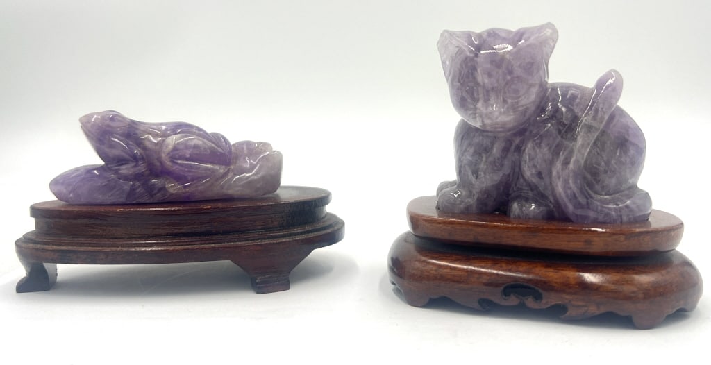 2 Chinese Amethyst Figurines: Amethyst Cat: 4x2.5x3.62, comes with wooden base, has marked label on bottom, tip of both ears are chipped. Amethyst Frog: 4.62x2.37x2.87 inches, comes with wooden base, no label or marking. See