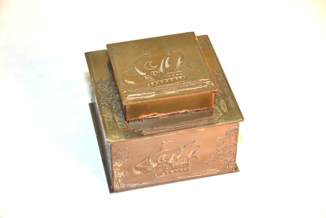 BRASS INKWELL W/SHIP MOTIF: Brass inkwell with ship motif, 3" tall x 4" wide