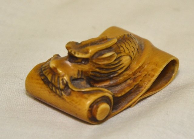 IVORY NETSUKE: Dragon, signed on bottom, 1 1/2" wide