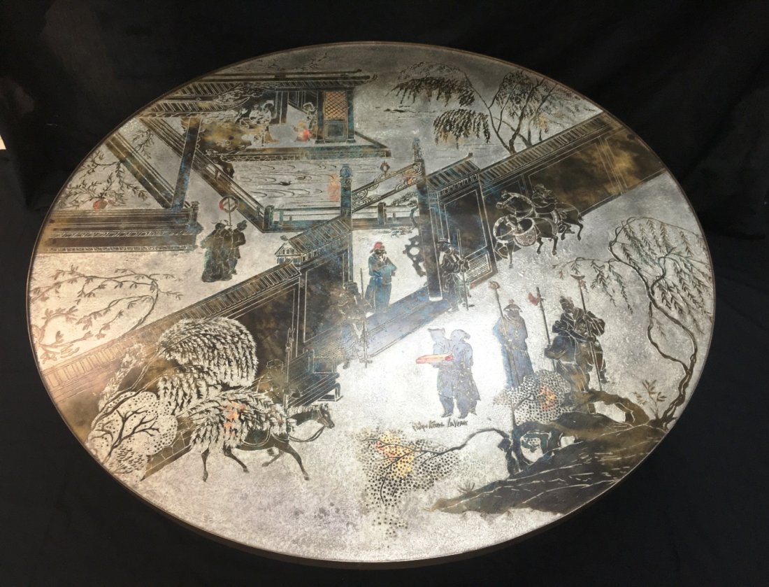 A PHILIP AND KELVIN LAVERNE COCKTAIL TABLE: Etched, bronze, and pewter table, signature, measuring 47.5" across