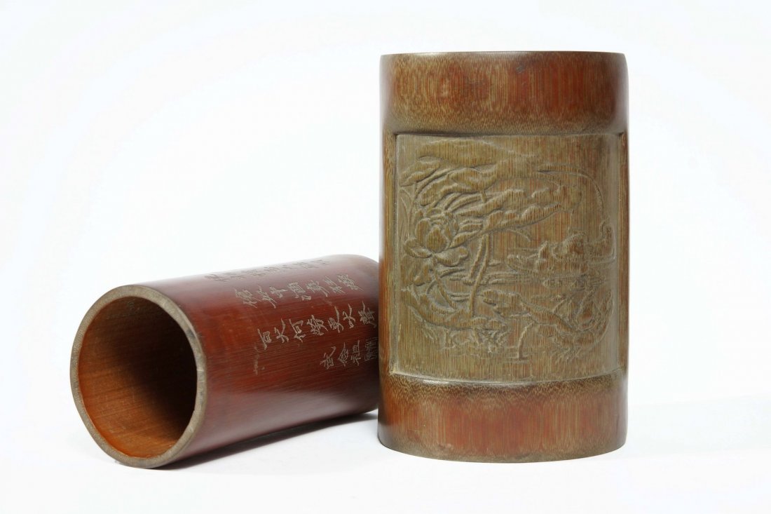 A pair of bamboo pen holders: A pair of bamboo pen holders, 6.5" high & 5.85" high.