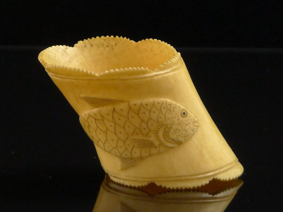 Vintage Chinese Large Carved Ivory Ring?: A fantastic antique large carved ivory ring. Shaped borders with the image of a fish deeply carved and raised above the surface. Approx 2.5" high and 1.75" diameter.